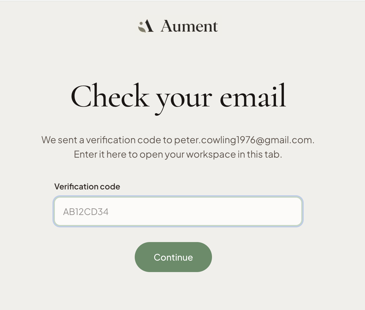 Aument check your email verification page with a code input and continue button.